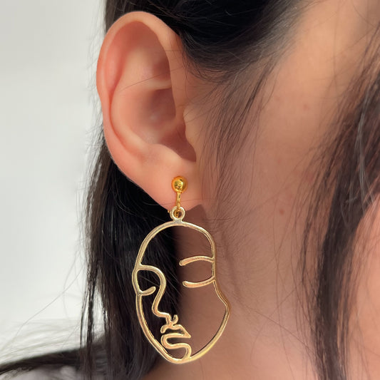 abstract face earrings • gold